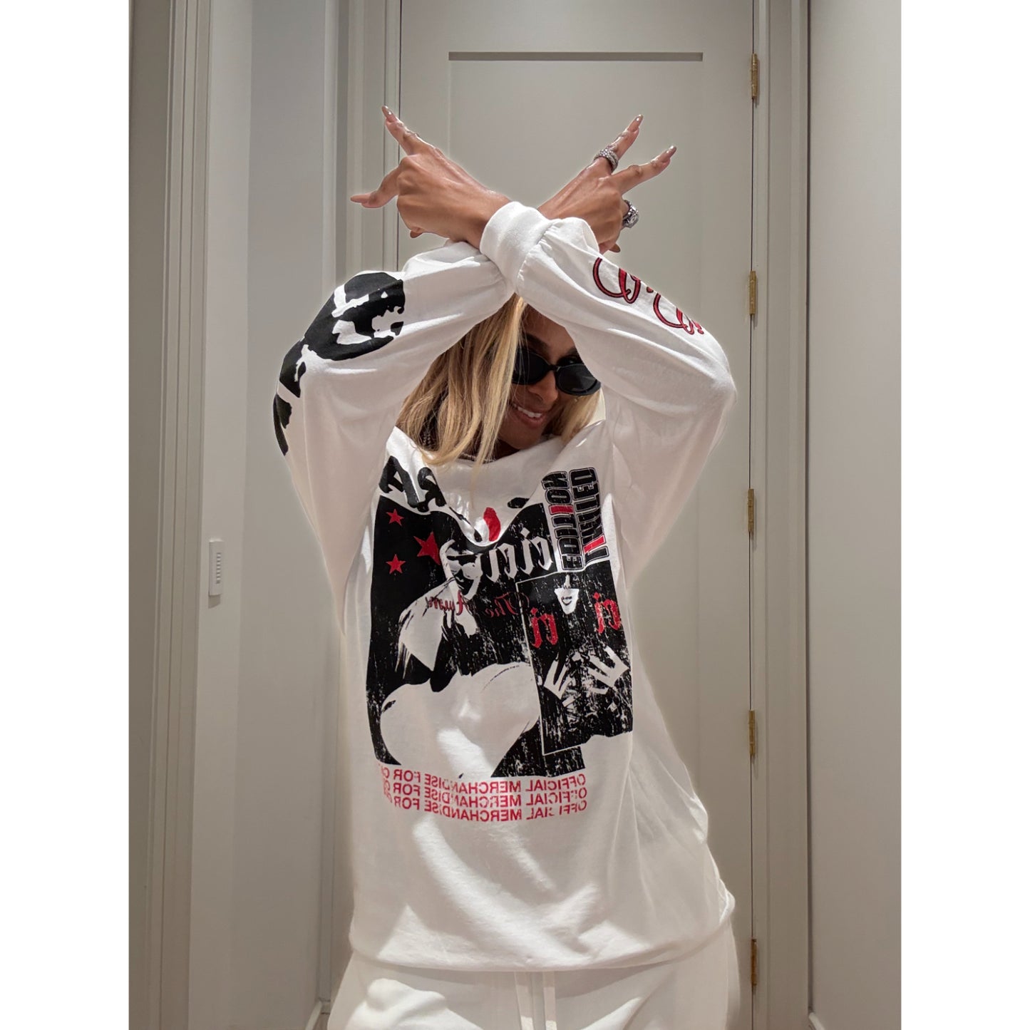 Ciara wearing the limited edition long-sleeve tee in white